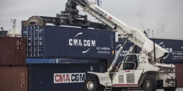 A Terex Corp. reach stacker transports a CMA CGM SA shipping container in the Med Europe Terminal at the Port of Marseille, France, on Friday, Dec. 18, 2015. Marseilles-based CMA CGM currently has 8.8 percent of the global shipping market.