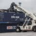 A Terex Corp. reach stacker transports a CMA CGM SA shipping container in the Med Europe Terminal at the Port of Marseille, France, on Friday, Dec. 18, 2015. Marseilles-based CMA CGM currently has 8.8 percent of the global shipping market.