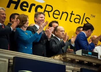 Larry Silber, president and chief executive officer of Herc Holdings Inc., center, rings the opening bell of the New York Stock Exchange (NYSE), in New York, U.S., on Friday, July 1, 2016. The U.S. IPO market may prove resilient, as markets bounce back from the aftershock of the U.K.'s decision to leave the European Union last week.