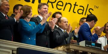 Larry Silber, president and chief executive officer of Herc Holdings Inc., center, rings the opening bell of the New York Stock Exchange (NYSE), in New York, U.S., on Friday, July 1, 2016. The U.S. IPO market may prove resilient, as markets bounce back from the aftershock of the U.K.'s decision to leave the European Union last week.