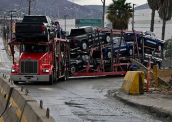 A truck carrying vehicles near the Otay Mesa Port of Entry, on the US-Mexico border in Tijuana, Baja California, Mexico, on Monday, Jan. 27, 2025. Cargo like cars move along the border economy as US President Donald Trump signaled plans to impose previously threatened tariffs of as much as 25% on Mexico and Canada by Feb. 1, unless the US neighbors did more to clamp down on immigration.