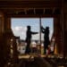 Construction workers install frames for windows and doors in a home being built in Bloomfield Hills, Michigan.
