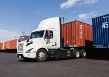 LONG BEACH, CALIFORNIA: EV trucks pick up containers at the Hight Logistics trucking facility in Long Beach, California on Wednesday.