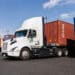 LONG BEACH, CALIFORNIA: EV trucks pick up containers at the Hight Logistics trucking facility in Long Beach, California on Wednesday.