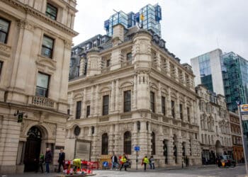 Detail of the Rogers Building, home to the offices of Lloyd's Register, above the The Collcutt building in London, UK, on Wednesday, March 26, 2025. Lloyds Register, the maritime society formed in a London coffee house in 1760, has put its modern glass headquarters up for sale as it prepares to move back into the property built to house it more than a century ago. 