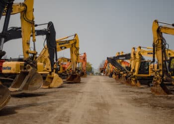 Excavators in the lot during a Ritchie Bros heavy equipment auction in Bolton, Ontario, Canada, on Tuesday, May 9, 2023. Ritchie Bros Auctioneers Inc., a Canadian firm that sells heavy equipment at auctions around North America, struck an agreement in November to buy IAA, which sells damaged and written-off vehicles. Antitrust
