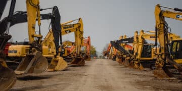 Excavators in the lot during a Ritchie Bros heavy equipment auction in Bolton, Ontario, Canada, on Tuesday, May 9, 2023. Ritchie Bros Auctioneers Inc., a Canadian firm that sells heavy equipment at auctions around North America, struck an agreement in November to buy IAA, which sells damaged and written-off vehicles. Antitrust