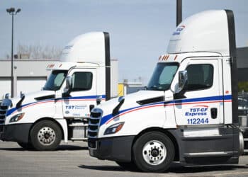 A TST-CF Express and TST Overland Express truck at the TFI International headquarters in Saint-Laurent, Quebec, Canada, on Thursday, April 24, 2025. TFI International Inc., one of North America's largest trucking companies, says US President Donald Trump's trade war is exacerbating the freight industry's difficult outlook, and that it was forced to abandon a deal because of it.
