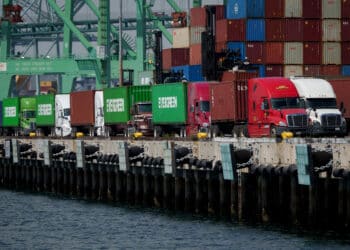 Trucks and shipping containers at the Port of Los Angeles in Los Angeles, California, US, on Thursday, April 24, 2025. China said it will fully prepare emergency plans to ward against increasing external shocks, taking a patient approach in defending growth as a deepening trade war with Donald Trump piles pressure on the worlds No. 2 economy.
