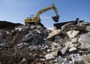 A Komatsu Ltd. excavator loads debris into a truck at the construction site of the Amazon.com Inc. Operations Center of Excellence at the Nashville Yards development in Nashville, Tennessee, U.S., on Monday, April 1, 2019. U.S. construction spending increased 1.0% in February, beating expectations, after climbing 2.5% in January and 0.2% in December.