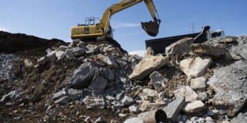 A Komatsu Ltd. excavator loads debris into a truck at the construction site of the Amazon.com Inc. Operations Center of Excellence at the Nashville Yards development in Nashville, Tennessee, U.S., on Monday, April 1, 2019. U.S. construction spending increased 1.0% in February, beating expectations, after climbing 2.5% in January and 0.2% in December.