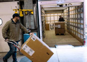 Workers load a truck at Earl B. Feiden Appliance in Latham, New York, US, on Thursday, April 18, 2024. The US Census Bureau is scheduled to release durable goods orders figures on April 24.