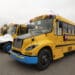 Lion C electric school buses outside the Lion Electric assembly plant in Saint-Jerome, Quebec, Canada, on Thursday, Oct. 13, 2022. Lion Electric Co. designs, develops, manufactures, and distributes purpose-built all-electric medium and heavy-duty urban vehicles, including seven mid range truck and bus models.