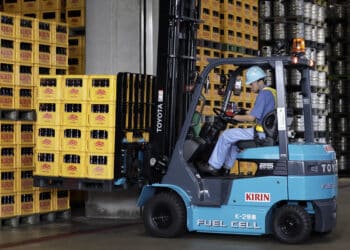 A worker transports crates of beer at a Kirin Brewery Co. plant using a hydrogen-powered Toyota Industries Corp. fuel cell forklift truck during a demonstration of a hydrogen supply chain system in Yokohama, Japan, on Wednesday, July 12, 2017. The public-private partnership including Toyota Motor Crop. has established the low-carbon hydrogen supply chain that utilizes electricity generated by wind to power the forklifts at the nearby market, factory and warehouses.