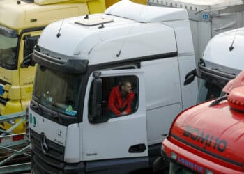 Driver speaks to fellow driver from the cab of his truck as he waits in Dover, U.K., on Tuesday, Dec. 22, 2020. British Prime Minister Boris Johnson said he's trying to re-open trade routes to France "as fast as possible" after a day of cross-Channel political bartering failed to end the chaos at the U.K.'s busiest port.