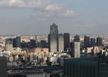 Commercial and residential buildings rise out of the skyline in this elevated view of Tokyo, Japan, on Thursday, Nov. 13, 2008. Real estate values are tumbling in New York, London and Tokyo as the global credit crisis has roiled lending and sidelined buyers.