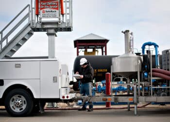 Steve Pishler, a master service technician with Determan Fluid Solutions, performs a semi-annual calibration on an ethanol delivery pump at the Great River Energy Blue Flint Ethanol plant in Underwood, North Dakota, U.S., on Thursday, Feb. 9, 2012. North Dakota will hold its Republican presidential caucus on March 6.