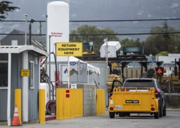 A vehicle pulls a Global Holdings Inc. trailer into an equipment rental location in Berkeley, California, U.S., on Friday, May 6, 2016. Hertz is scheduled to release earnings figures on May 9.