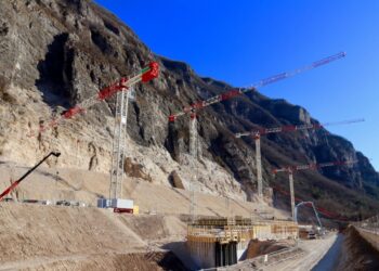 Several Terex CTT flat-top tower cranes captured at work in Italy