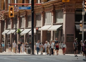 Pedestrians on Queen St. in Toronto, Ontario, Canada, on Thursday, July 3, 2025. Canadian consumer prices held steady while core measures eased slightly, likely giving some relief to Bank of Canada policymakers who had raised concerns about hotter underlying inflation prints in recent months.