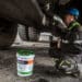 Workers labor under the carriage of a dump truck in a repair shop at the Tavan Tolgoi coal deposit developed by Erdenes Tavan Tolgoi JSC, a unit of Erdenes Mongol LLC, in Tsogtsetsii, Ömnögovi Province, Mongolia, on Monday, Sept. 24, 2018. Mongolia has expanded its coal reserves by 24 percent at the state-owned giant Tavan Tolgoi mine to 6.34 billion tons, according to Erdenes Tavan Tolgoi Chief Executive Officer Gankhuyag Battulga. Mongolian lawmakers in June approved a plan to sell up to 30% of the coal mine in the Gobi desert, the latest attempt to develop what's anticipated to be massive coking and thermal coal deposit.