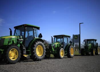 Trump urges tractor makers to cut costs as vexed farmers get aid