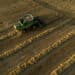 A Deere & Co. combine harvester is used to harvest soft red winter wheat in this aerial photograph taken over Kirkland, Illinois, U.S., on Friday, July 17, 2020. U.S. winter wheat production is forecast at 1.22 billion bushels, down 4% from the June 1 forecast and 7% below 2019.