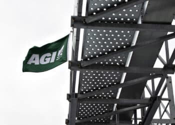 An Ag Growth International flag flies atop a grain bin during a Farm Progress Show in Boone, Iowa.