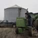 Michlig Energy driver Jake Gould delivers diesel fuel to a John Deere & Co. tractor in Manlius, Illinois, U.S., on Wednesday, Dec. 10, 2014. Gasoline supplies rose 8.2 million barrels to 216.8 million in the week ended Dec. 5, the biggest gain since the week ended Sept. 21, 2001. Inventories of distillate fuel, a category that includes diesel and heating oil, climbed 5.58 million to 121.8 million, the biggest increase since January
