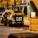 A Caterpillar Inc. 248B skid steer loader aids contractors during road work in Topeka, Indiana, U.S., on Monday, Oct. 24, 2011. Caterpillar Inc., the world's largest construction and mining-equipment maker, posted third-quarter profit and sales that topped analysts' estimates as demand rose for shovels and drills used to dig up metals.