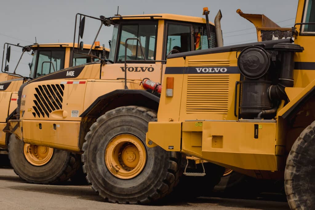 Volvo dump trucks in a lot during a Ritchie Bros heavy equipment auction in Bolton, Ontario, Canada, on Tuesday, May 9, 2023. Ritchie Bros Auctioneers Inc., a Canadian firm that sells heavy equipment at auctions around North America, struck an agreement in November to buy IAA, which sells damaged and written-off vehicles.