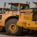 Volvo dump trucks in a lot during a Ritchie Bros heavy equipment auction in Bolton, Ontario, Canada, on Tuesday, May 9, 2023. Ritchie Bros Auctioneers Inc., a Canadian firm that sells heavy equipment at auctions around North America, struck an agreement in November to buy IAA, which sells damaged and written-off vehicles.