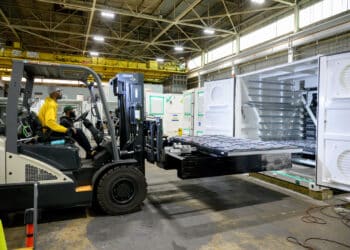 A worker drives a forklift at the Eos Energy Enterprises Inc. manufacturing facility in Turtle Creek, Pennsylvania, US, on Tuesday, May 27, 2025. Eos Energy, whose stock has surged more than 720% over the past year, has signed an initial pact with a large-scale developer of data centers as soaring power usage boosts demand for batteries.