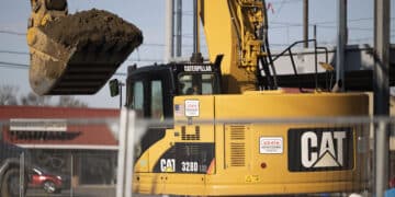 A Caterpillar Inc. bulldozer operates at a construction site in New York.