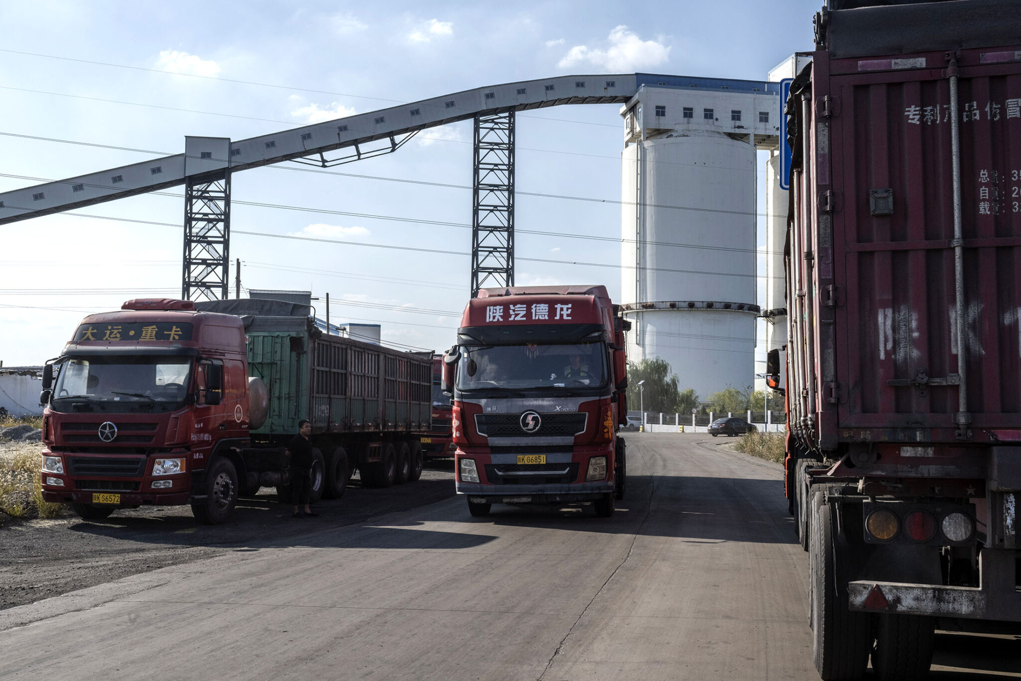 Trucks parked-up at the entrance of to a coal mine in Yulin.