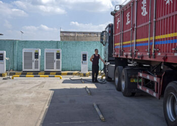 Qu Shaolong an electric truck driver during a charging demonstration at a charging station in Yulin, Shaanxi Province, China, on Monday, Sept. 21, 2026.