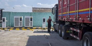 Qu Shaolong an electric truck driver during a charging demonstration at a charging station in Yulin, Shaanxi Province, China, on Monday, Sept. 21, 2026.